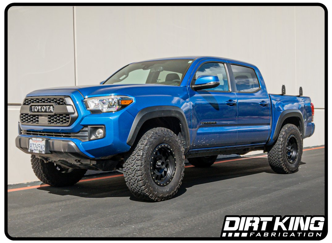 Dirt King 2005-2023 Toyota Tacoma with Performance Lower Control Arms in a parking lot
