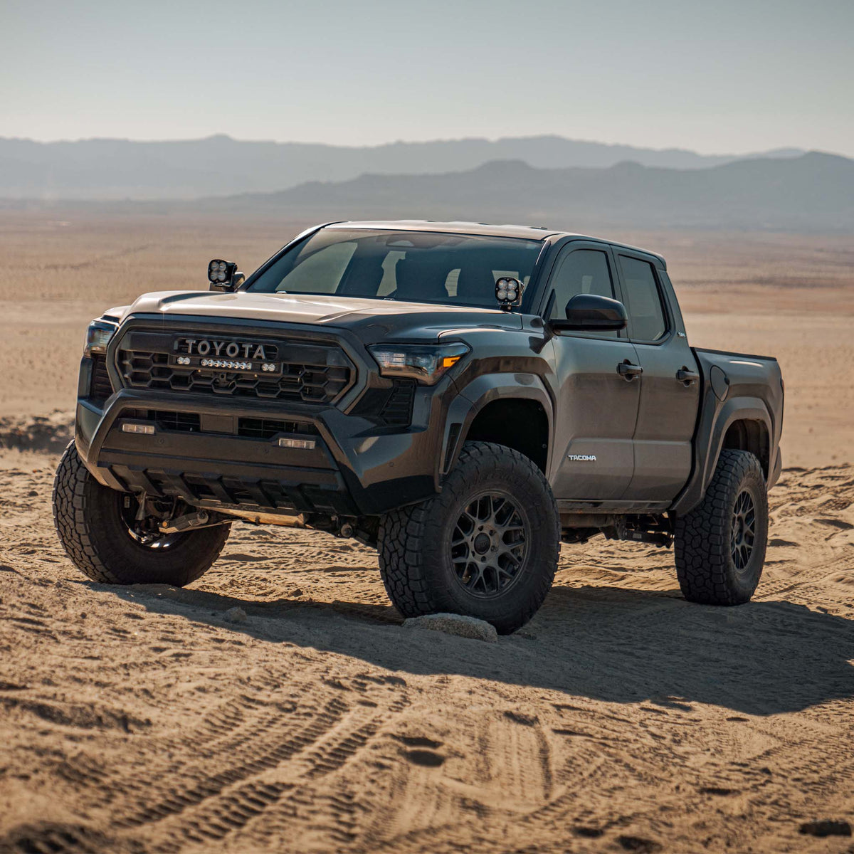 2024–2025 Toyota Tacoma - 2.5 Smooth Body Shocks | DCA Remote Reservoir on a Toyota Tacoma in the desert