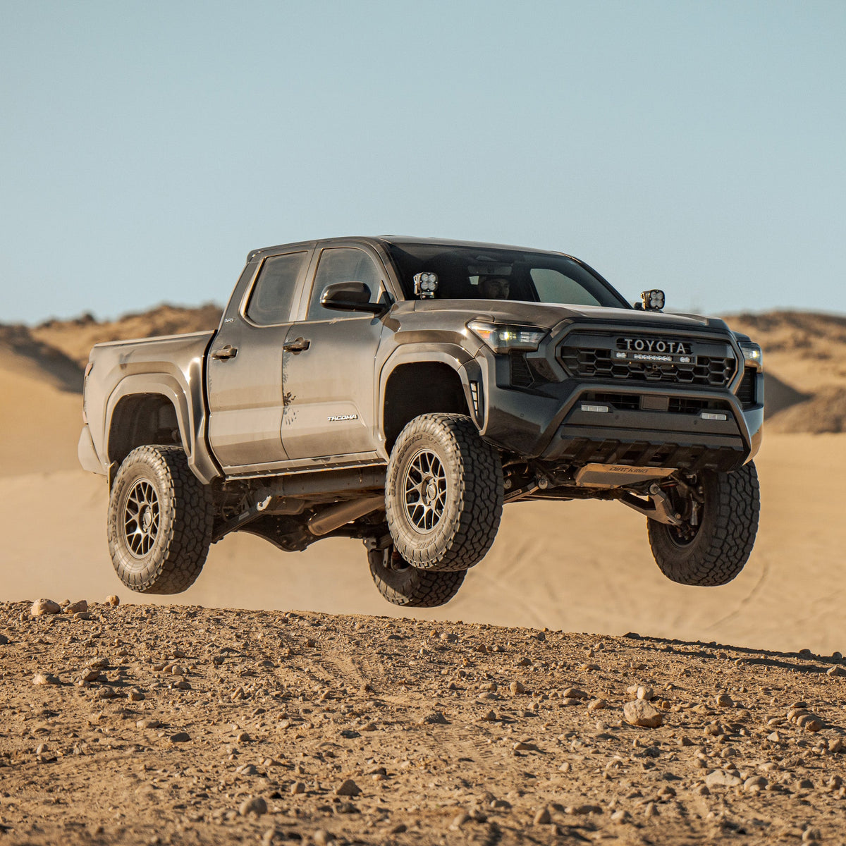 2024–2025 Toyota Tacoma - 2.5 Smooth Body Shocks | DCA Remote Reservoir on a Toyota Tacoma in the desert