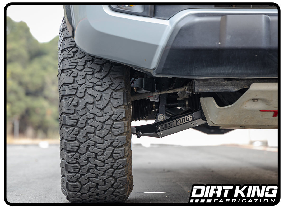 Dirt King 2005-2023 Toyota Tacoma - Performance Lower Control Arms installed on a grey tacoma