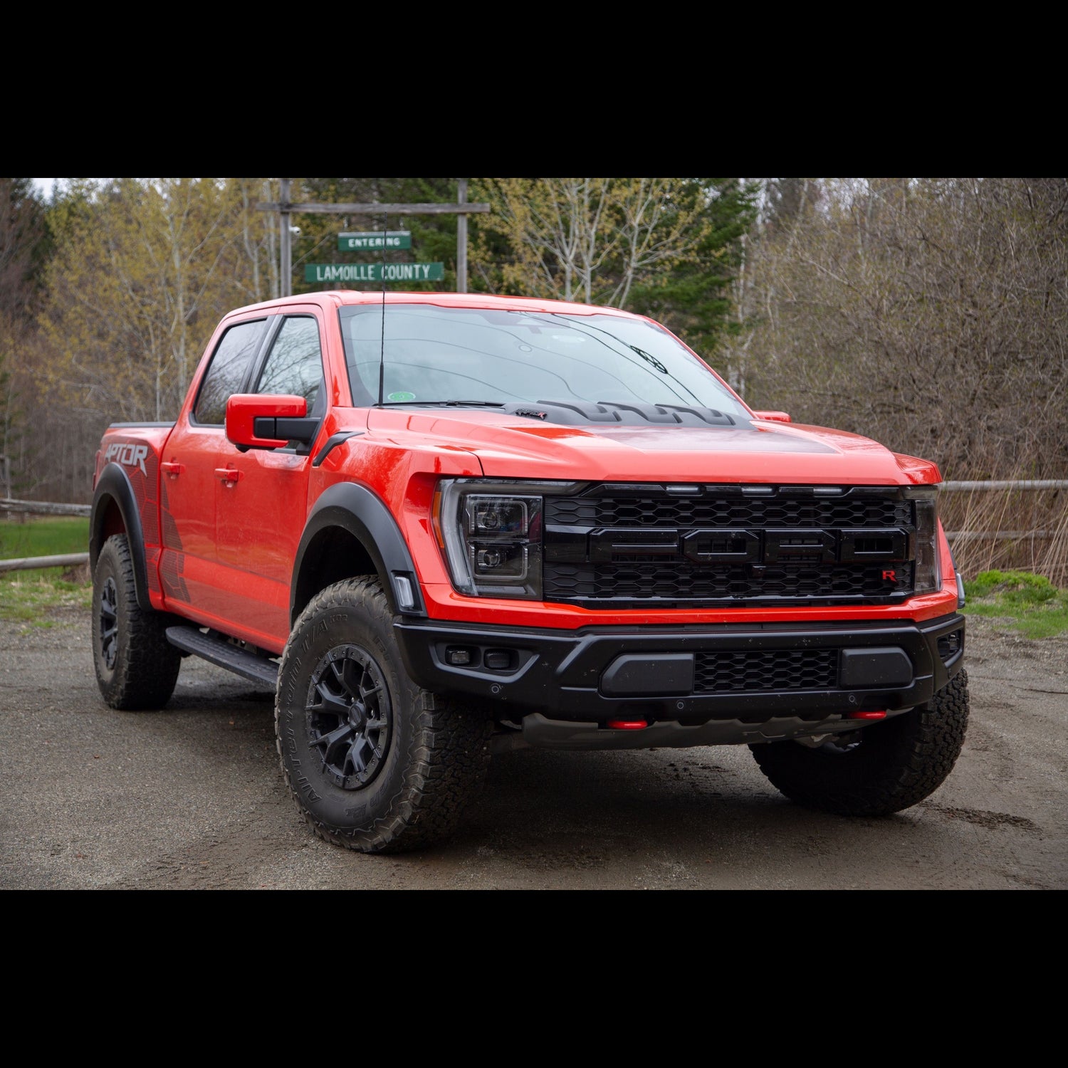 Red Ford F150 Raptor R on a dirt road