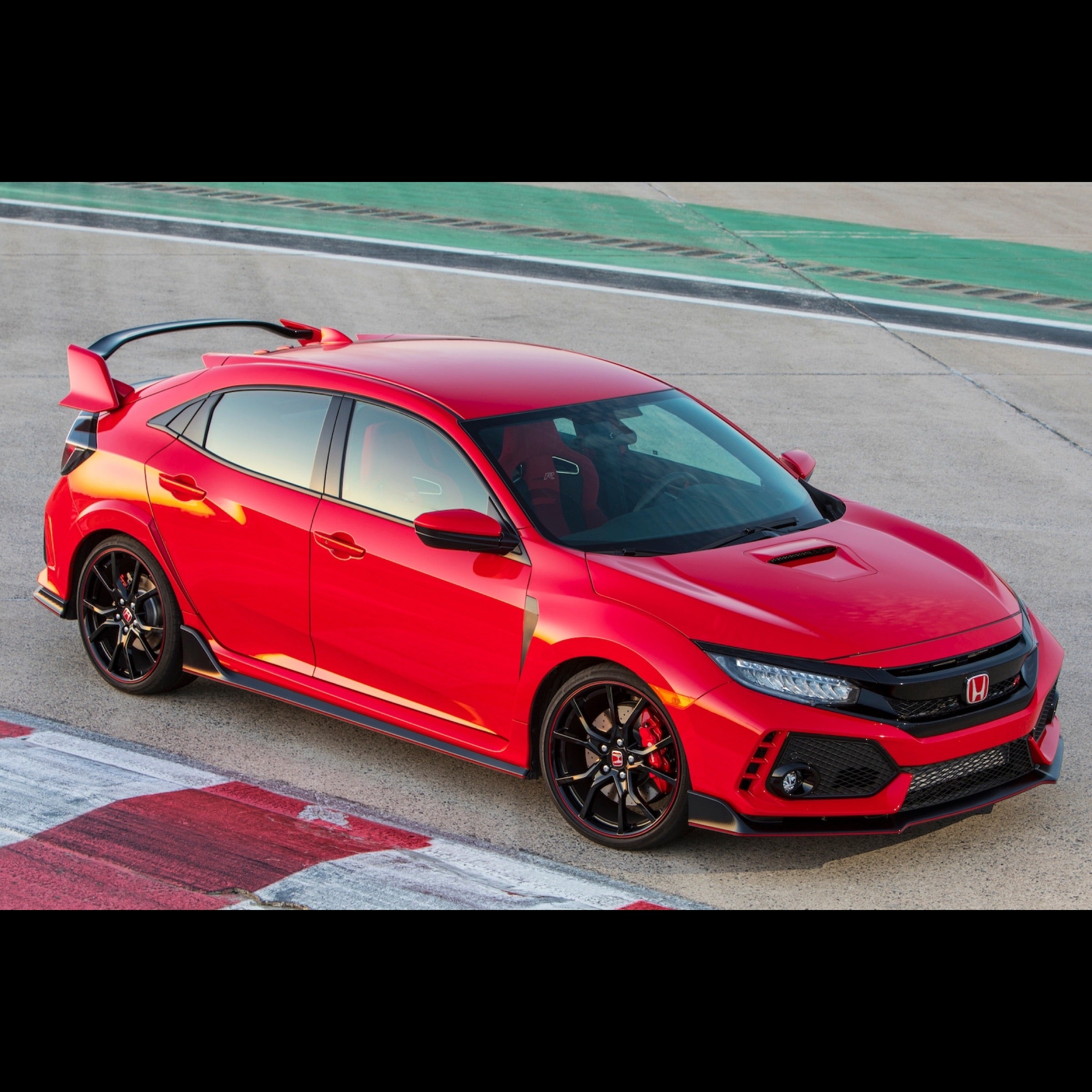 Honda Civic Type R in red on racetrack