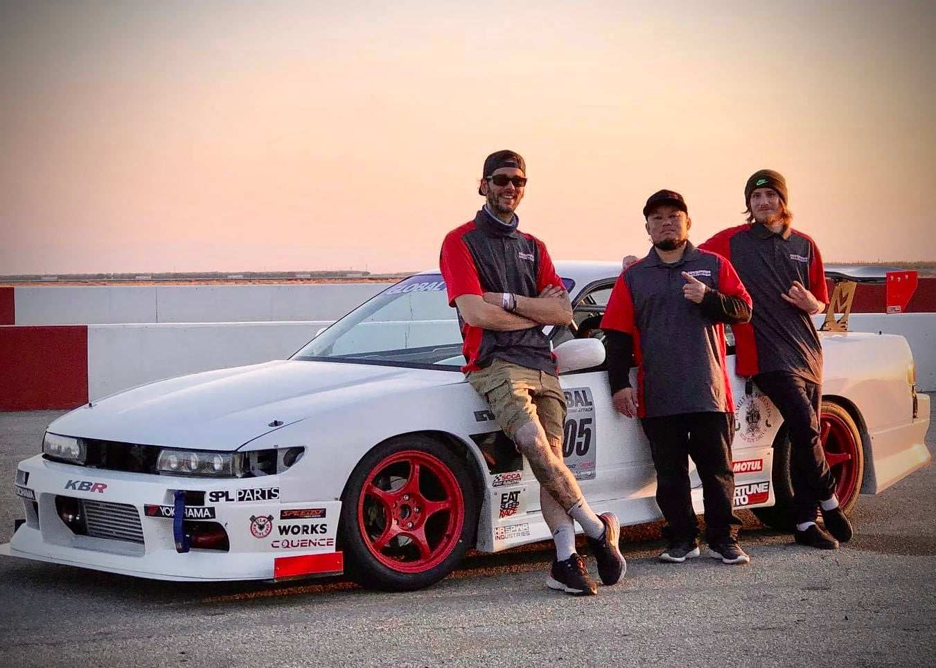 HRSPWR Industries racing team in front of white s13