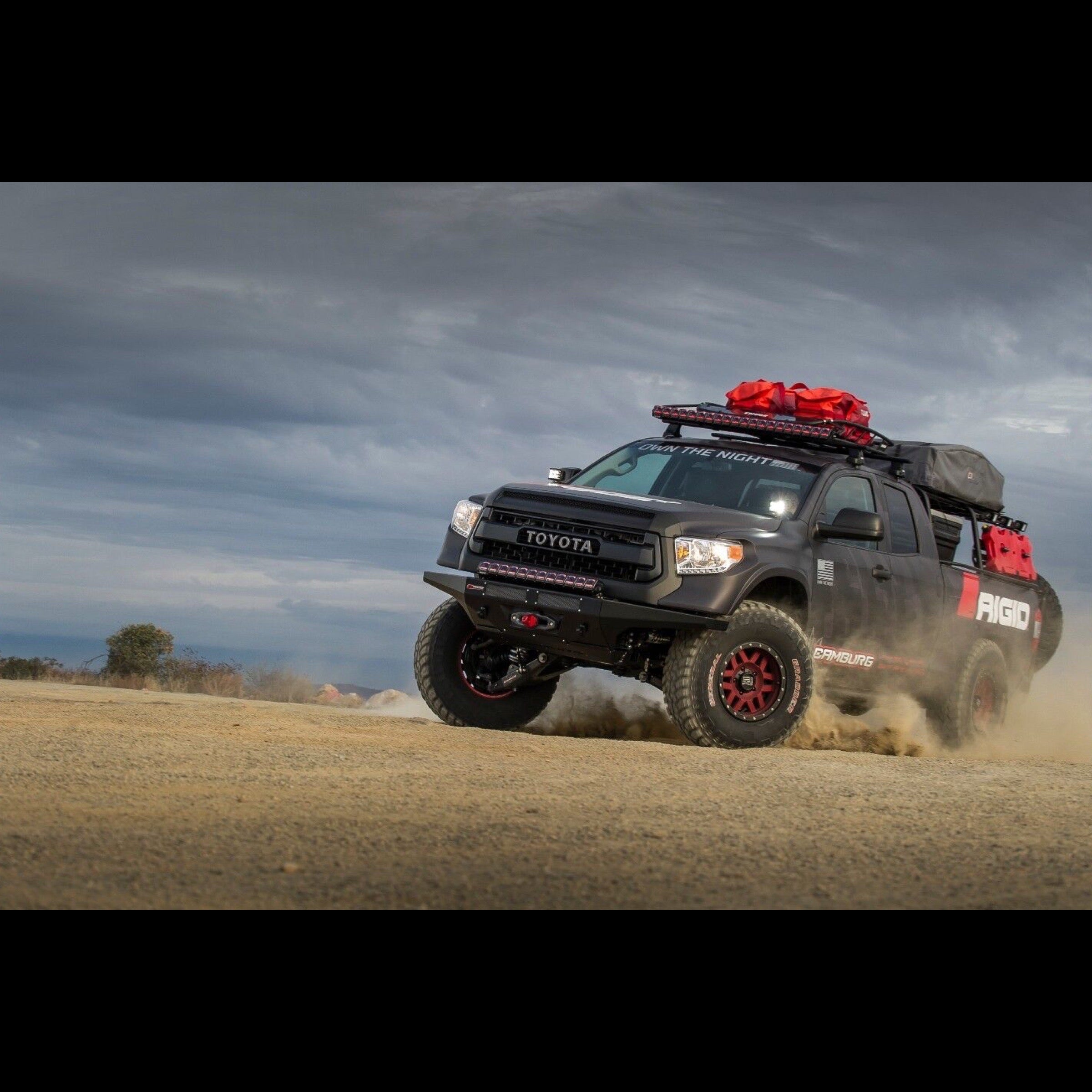 Rigid Industries Toyota Tundra spinning tire on a dirt road with rigid lights on