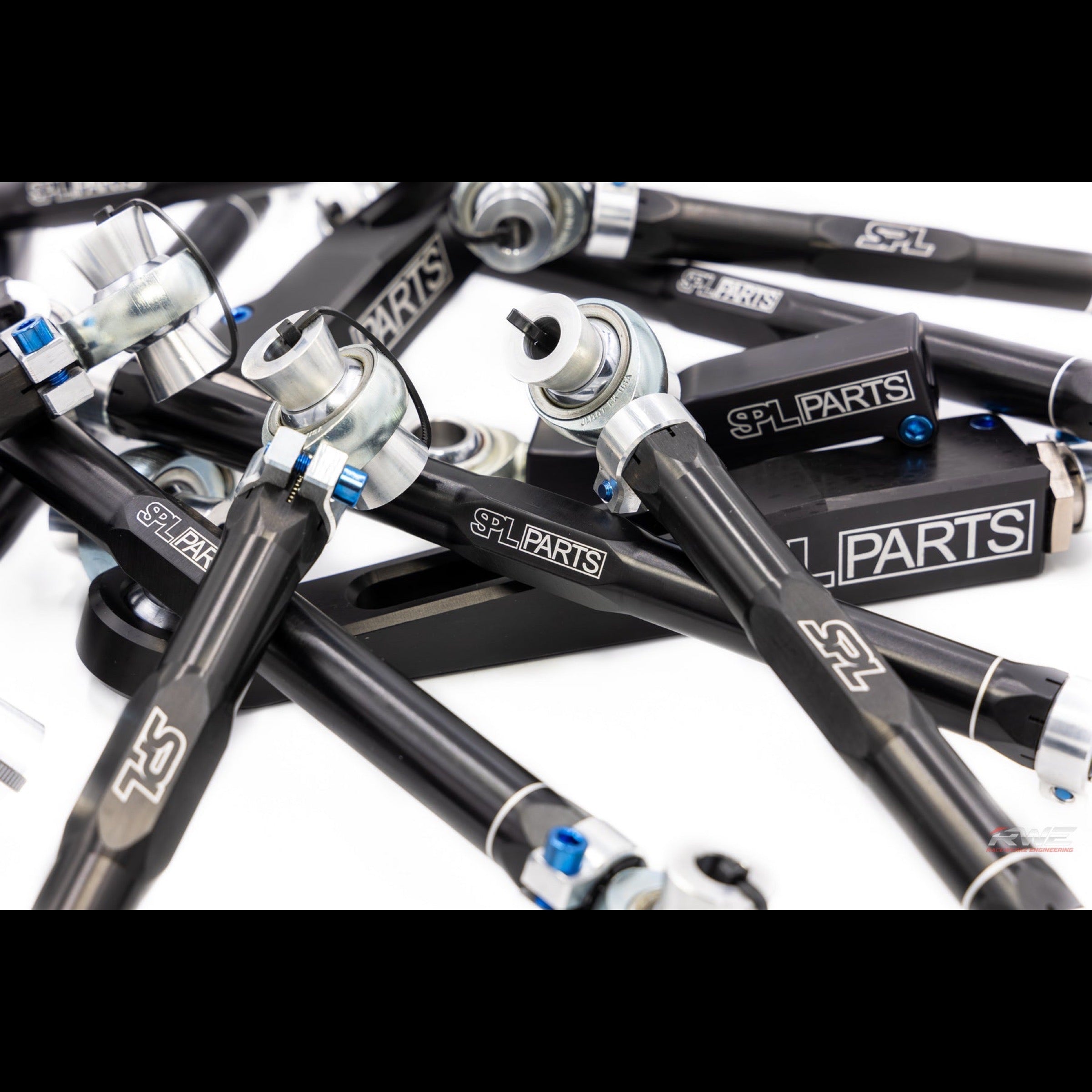 SPL Parts suspension arms in black with a white background
